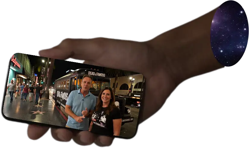 A hand holding a phone playing the tour advert